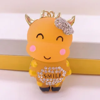 Zodiac Creative Metal Rhinestone Resin Smile Cow Car Keychain Pendant - Yellow