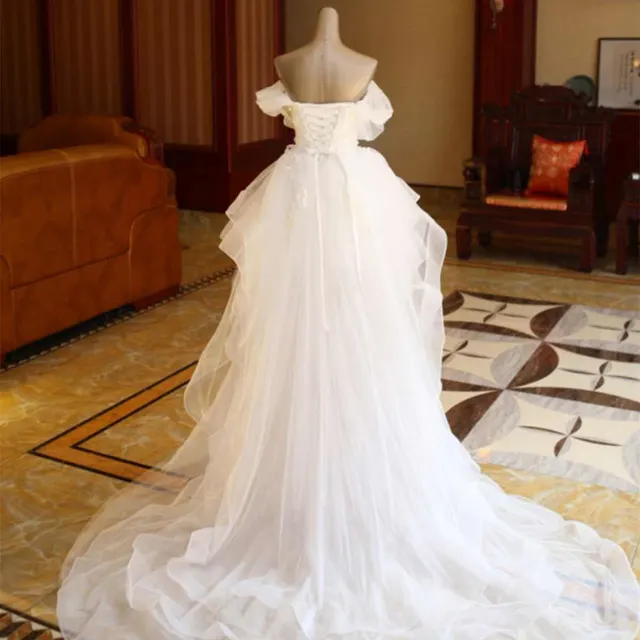 The Bride'S Wedding Dress With Long Tail In Front Of The Studio Default - Shop at LoveMi