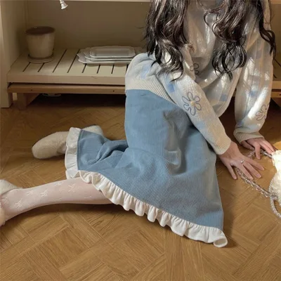 A Woman Wearing A Sweater With A Base Top Blue Skirt - Shop at LoveMi