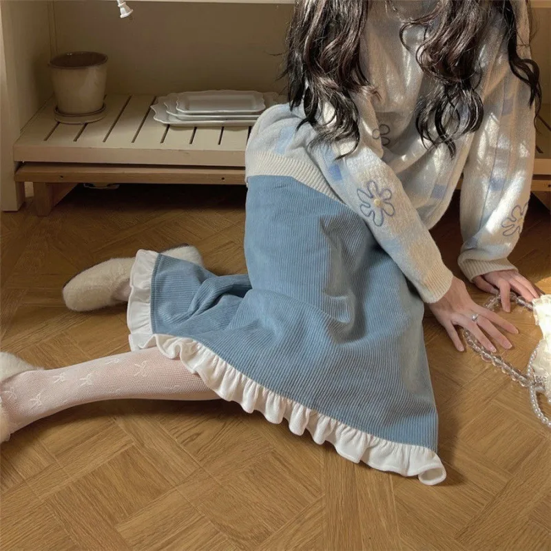 A Woman Wearing A Sweater With A Base Top Blue Skirt - Shop at LoveMi