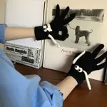 Hand Holding Gloves Black