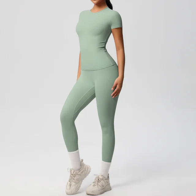 European And American Sports Nude Feel Skin friendly Solid Color Sports T shirt Stretch Short Sleeve Yoga Pants High Waist Workout Suit Women Bas... Basil Green - Shop at LoveMi